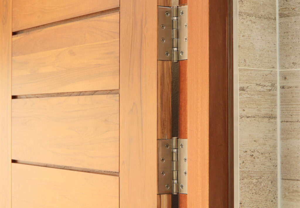 stainless door hinges on wooden swing door